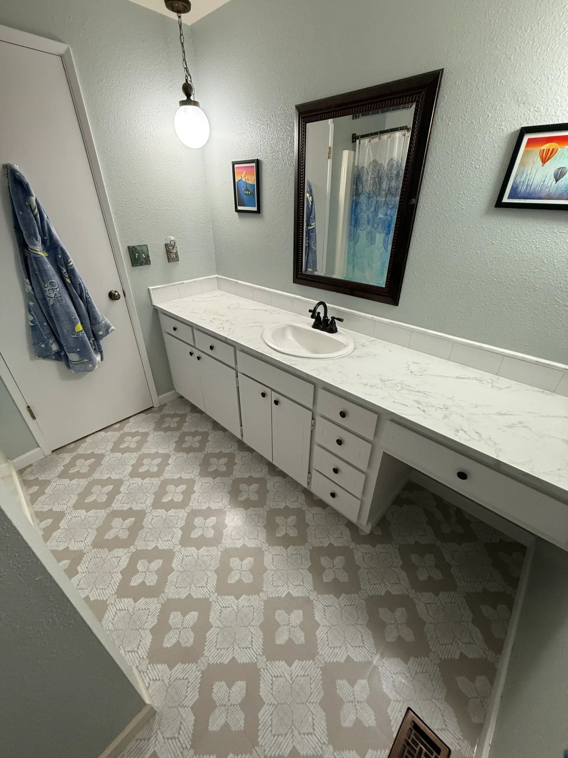 Bathroom remodeling project featuring a tiled shower, glass enclosure and modern double vanity